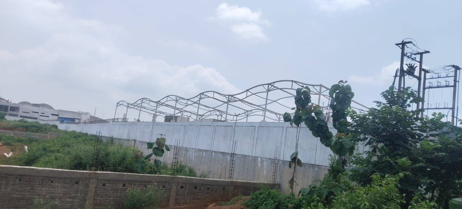 Jockey India Odisha wave tensile structure site view during steel frame work